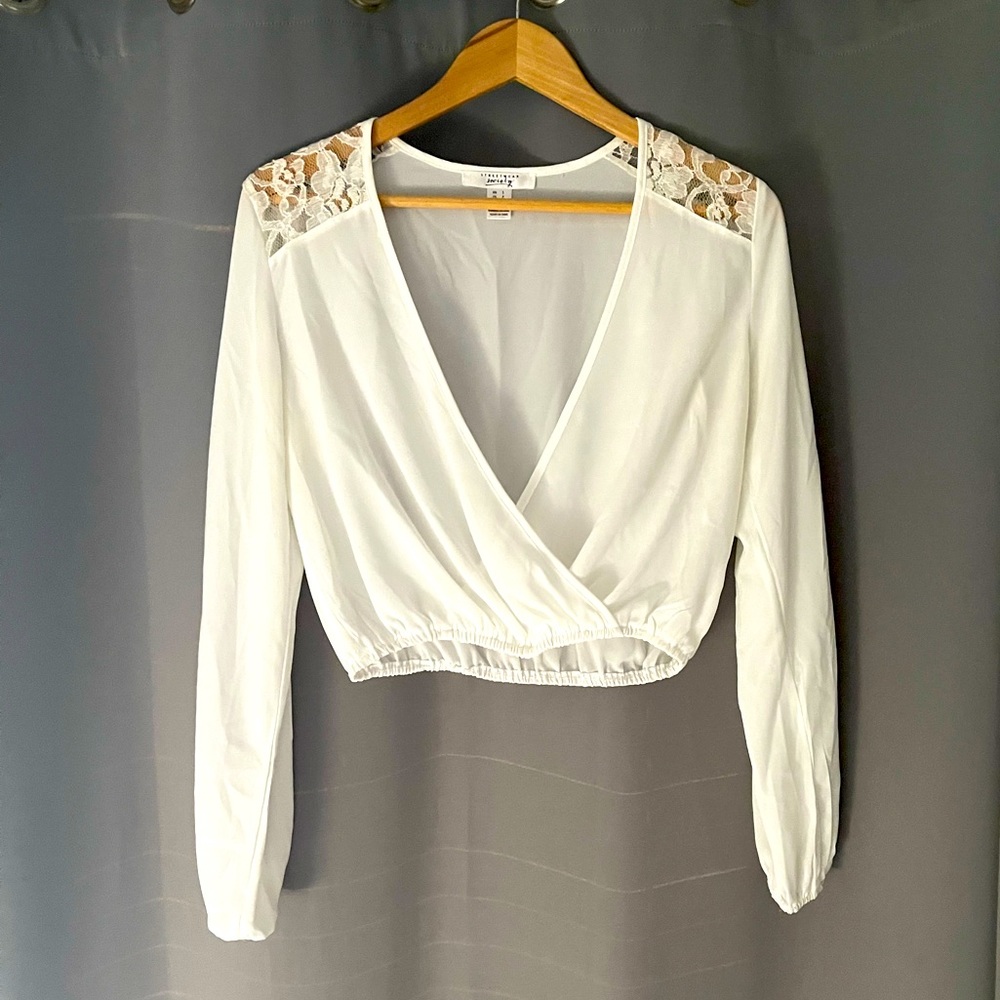 Off-white lace shoulder wrap look blouse